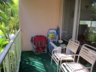 Our lanai view with beach chairs and more