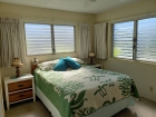 Bedroom with queen size bed and extra windows